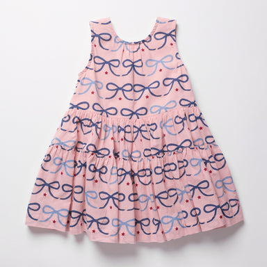 Pink dress with blue bow pattern on a white background