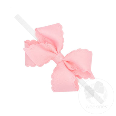 Pink bow headband on a white background