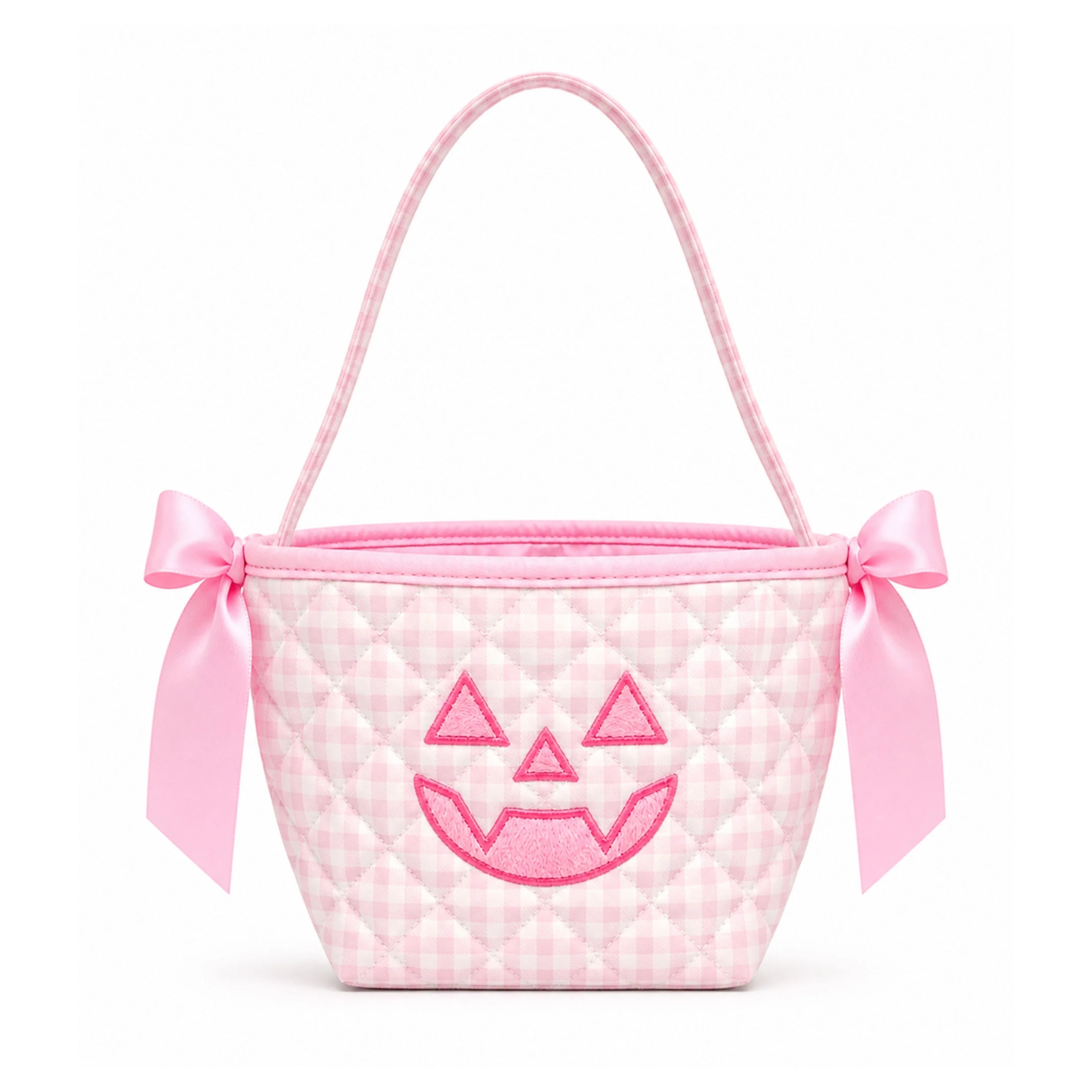 A pink gingham quilted mini bucket bag with a pink satin handle, bow details on the sides, and an embroidered jack-o'-lantern face on the front.