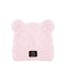 A light pink fuzzy beanie hat with two small bear ears on top and a small black rectangular logo patch on the front cuff, shown against a plain white background.