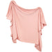 A pink blanket draped on a white background