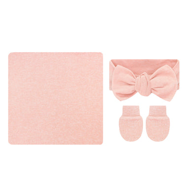 A baby accessory set featuring a square blanket, a matching bow headband, and a pair of mittens, all in a soft pink color, displayed on a solid white background.