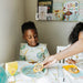 Boy eating off a school planner placemat