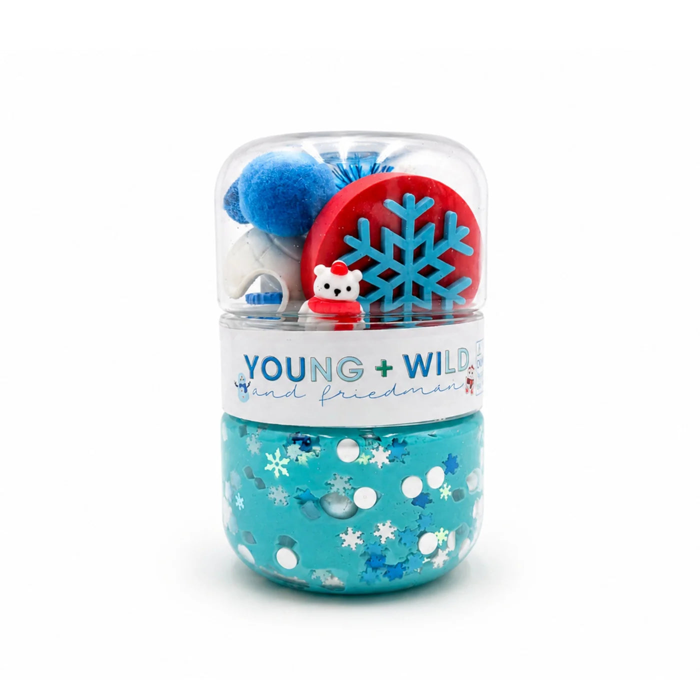 Polar bear sensory dough jar with blue dough and winter themed treasures including a snowflake accessory and tiny polar bear figure by Young Wild and Friedman