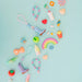 Colorful toys and items on a light blue background