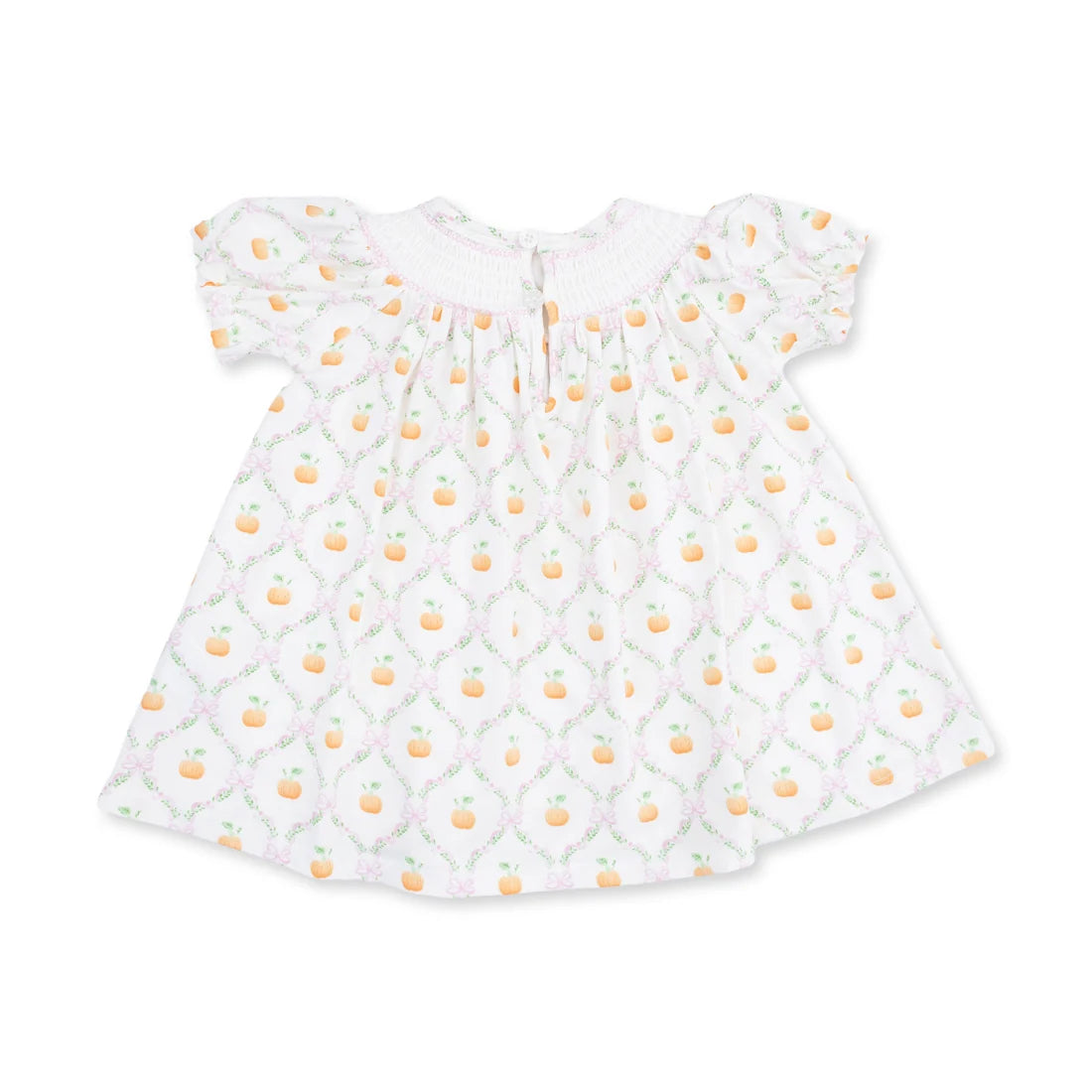 A white baby smocked dress with short flutter sleeves, featuring a repeating pattern of orange peaches and green leaves over a light pink trellis design.
