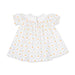 A white baby smocked dress with short flutter sleeves, featuring a repeating pattern of orange peaches and green leaves over a light pink trellis design.