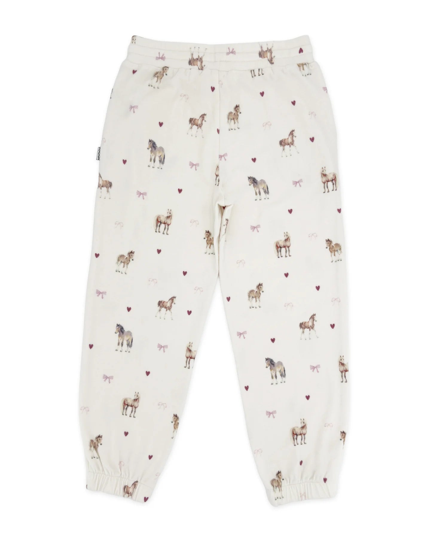 Off-white jogger pants with an all-over print of horses and small pink hearts, shown flat against a white background.