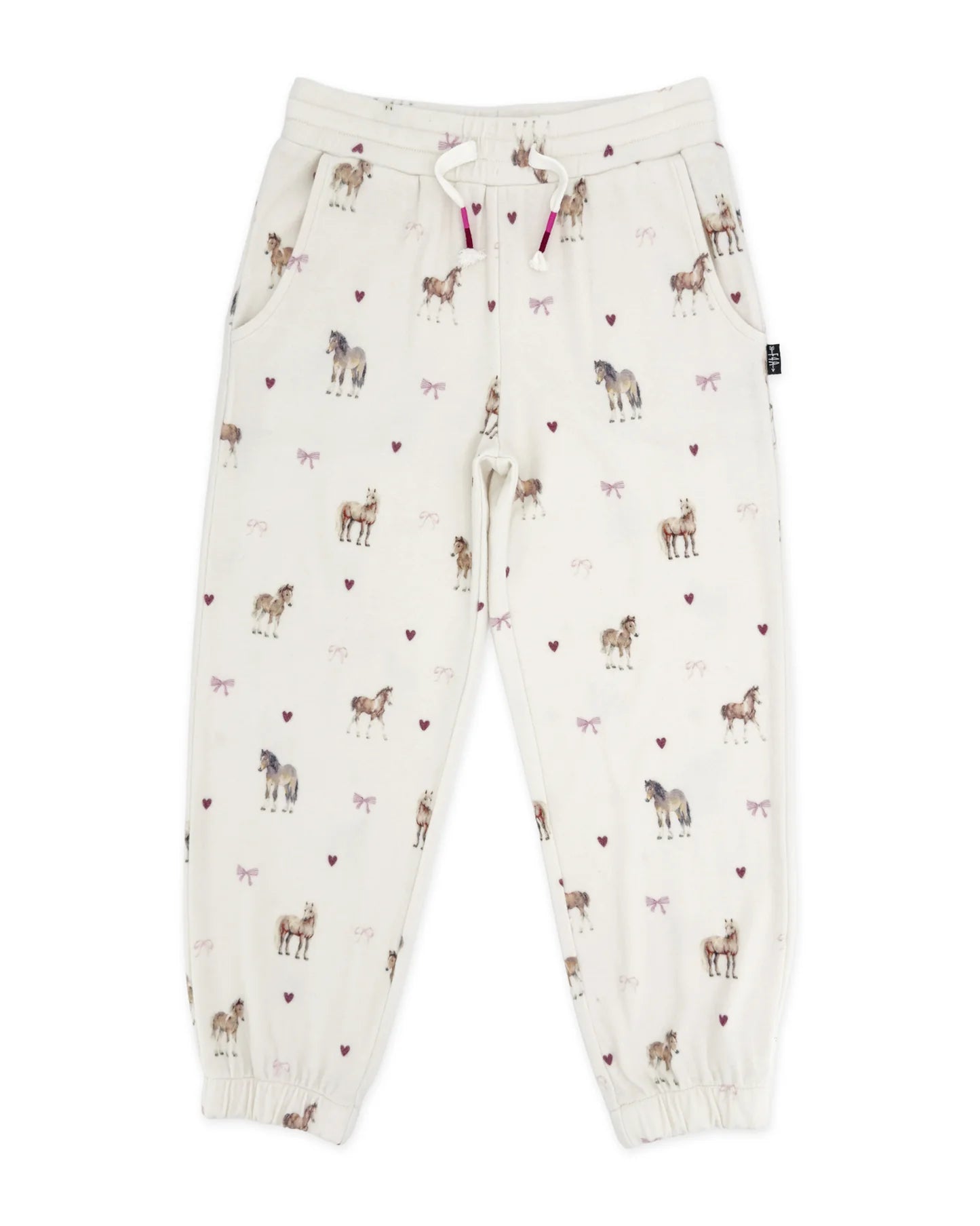 A pair of cream-colored jogger pants with an all-over print of horses and small hearts, featuring a drawstring waist and elastic cuffs.