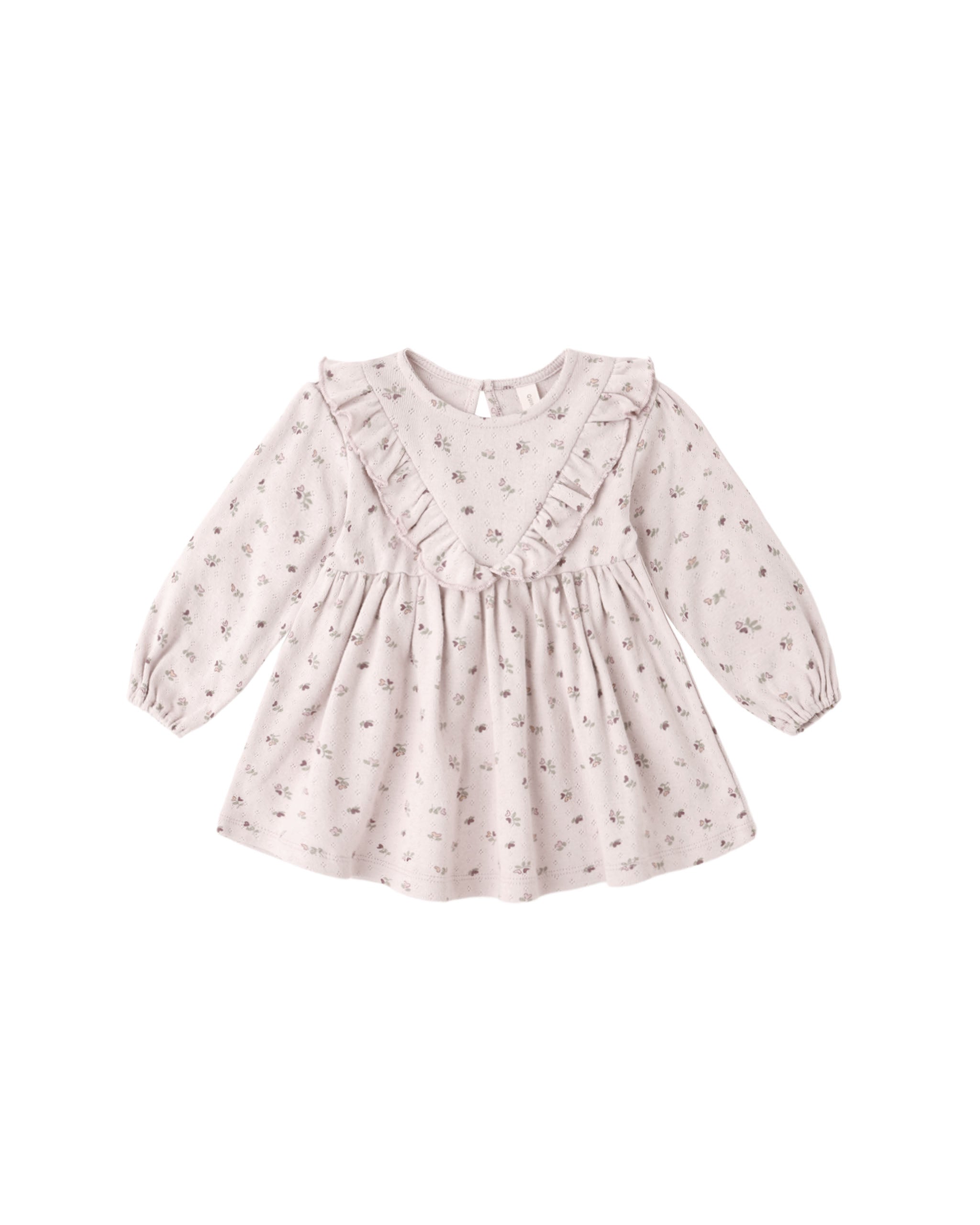 A long sleeve dress in classic pointelle fabric and features delicate v-ruffle detailing, a button-back closure for easy changing, and matching bloomers.