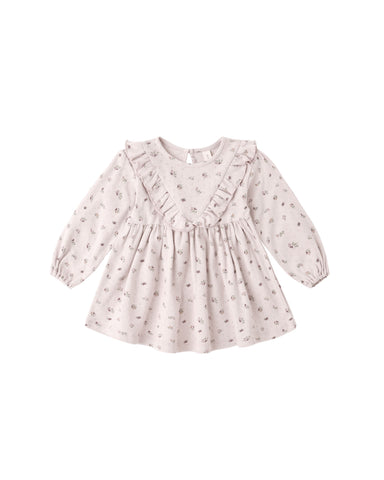 A long sleeve dress in classic pointelle fabric and features delicate v-ruffle detailing, a button-back closure for easy changing, and matching bloomers.