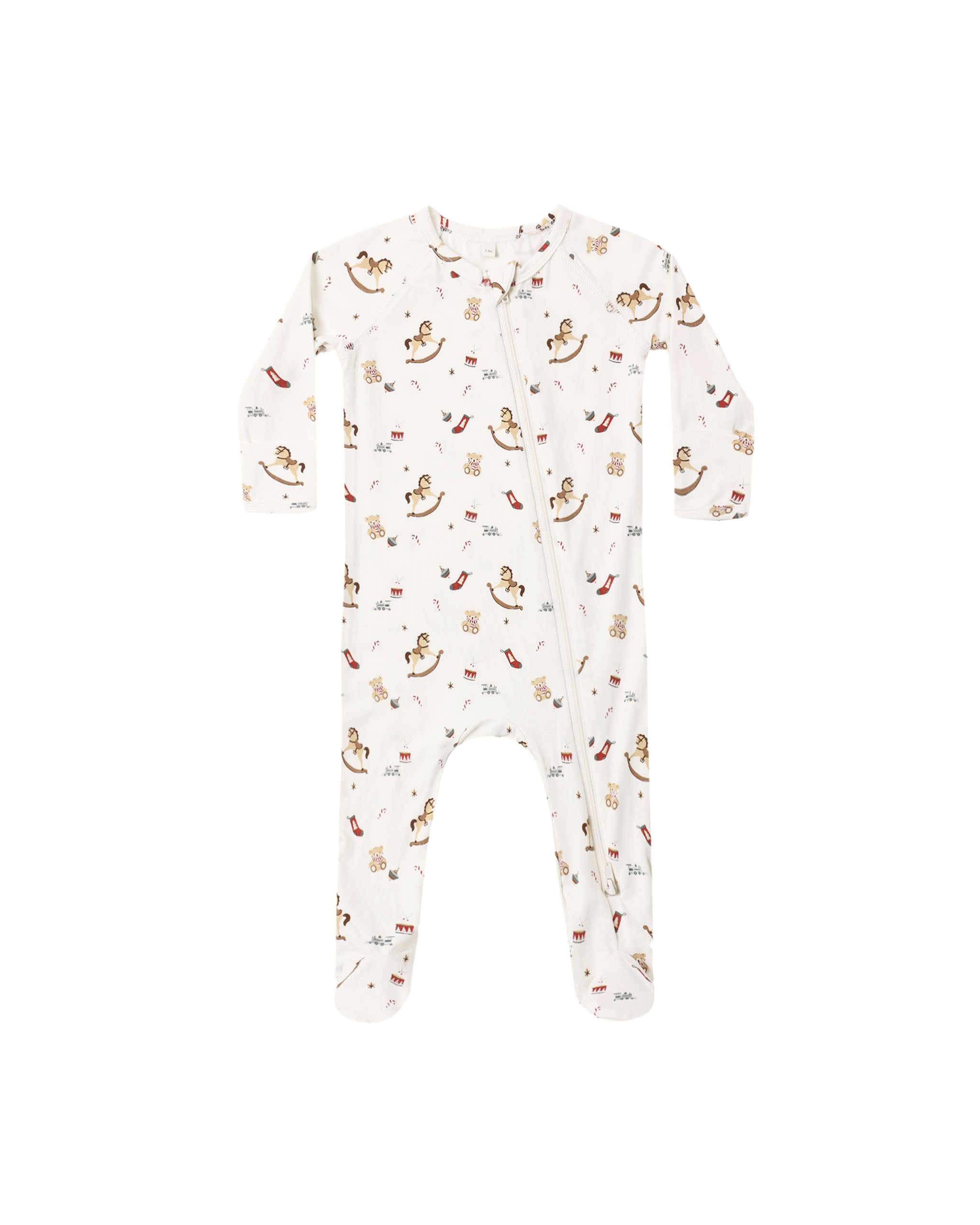 A baby long-sleeve footed sleeper in off-white with a repeating print of teddy bears, rocking horses, and small red hearts, shown flat against a white background.