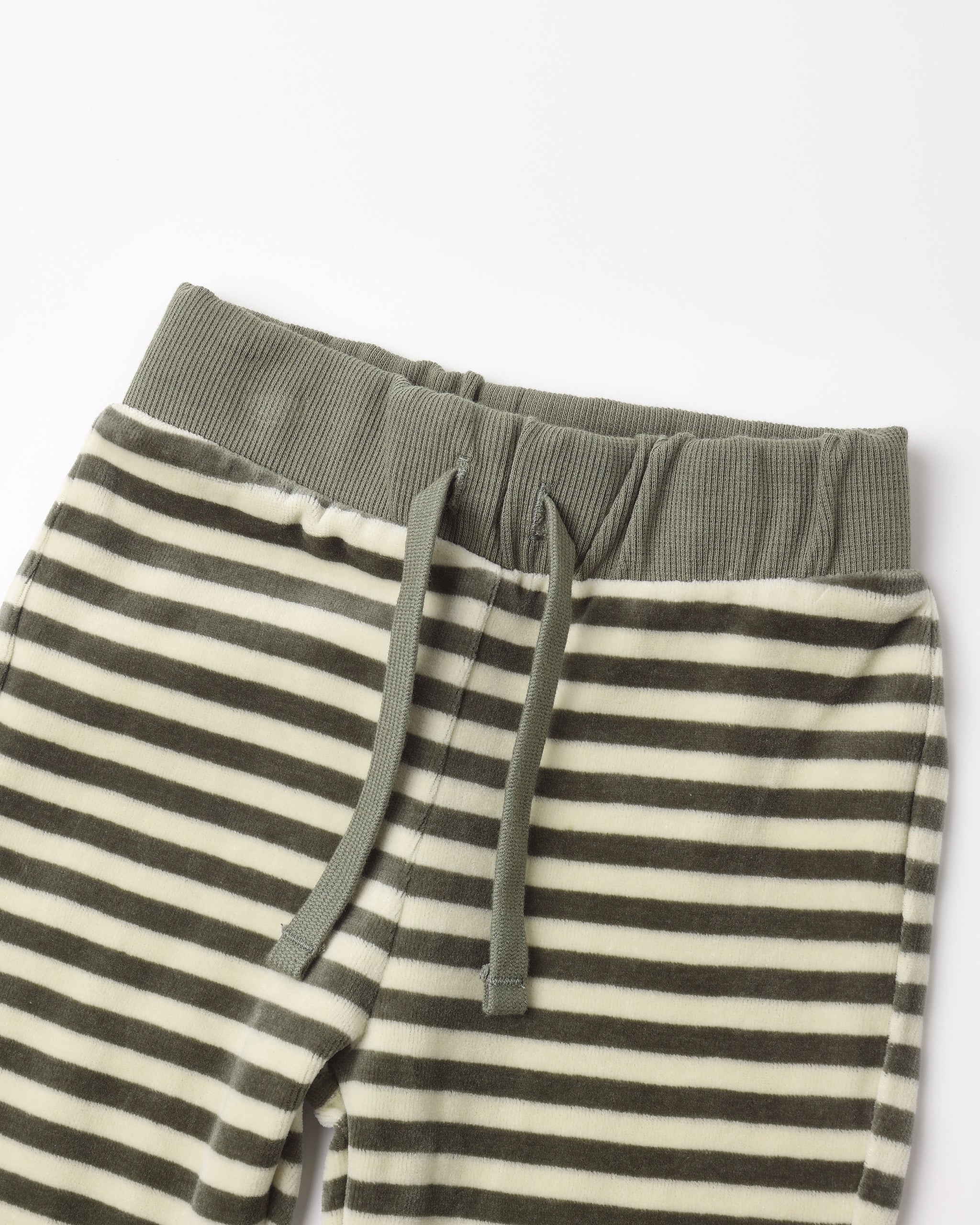 Close-up of striped lounge pants with an olive green ribbed waistband and matching drawstrings, shown on a plain light background.