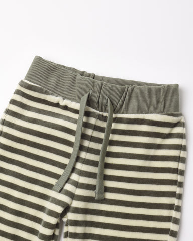 Close-up of striped lounge pants with an olive green ribbed waistband and matching drawstrings, shown on a plain light background.
