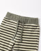 Close-up of striped lounge pants with an olive green ribbed waistband and matching drawstrings, shown on a plain light background.