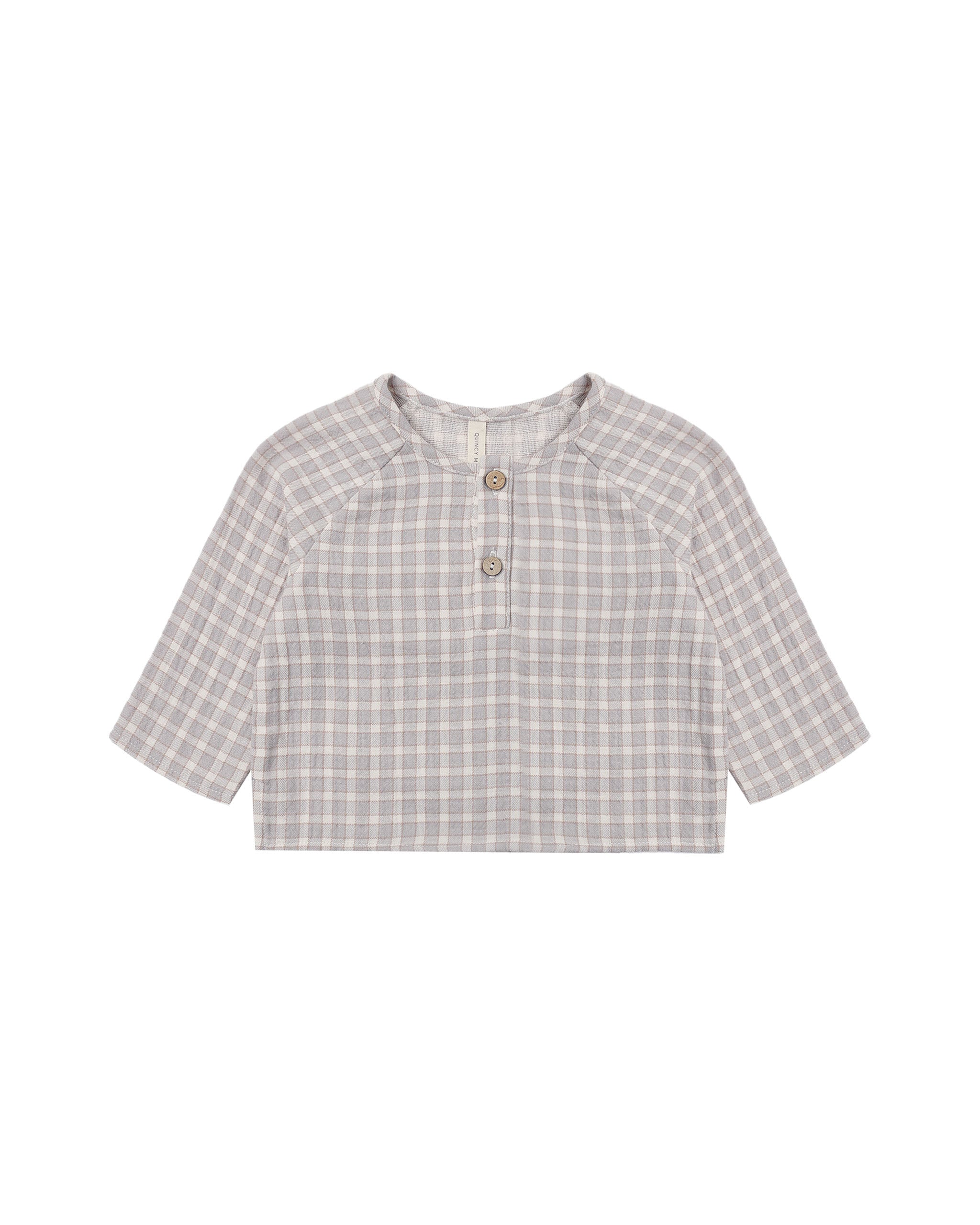 A short-sleeve children's henley top with a light blue gingham pattern, featuring a buttoned placket and three wooden buttons, displayed flat against a white background.