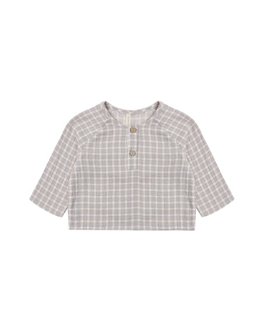 A short-sleeve children's henley top with a light blue gingham pattern, featuring a buttoned placket and three wooden buttons, displayed flat against a white background.