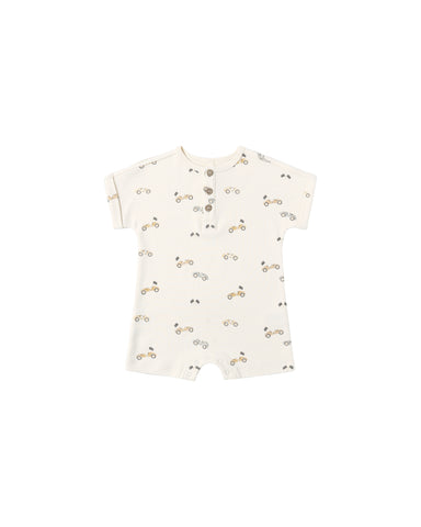 Baby romper with a racing car pattern on a white background