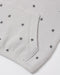 A close up a waffle grey fabric with a star pattern