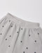 A close up a waffle grey fabric with a star pattern