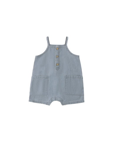 Light blue denim romper with button details on a white background