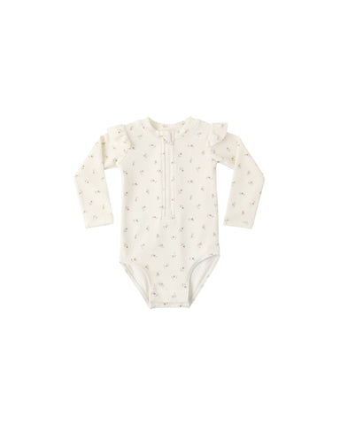 Baby floral rashguard with long sleeves and a zipper on a white background