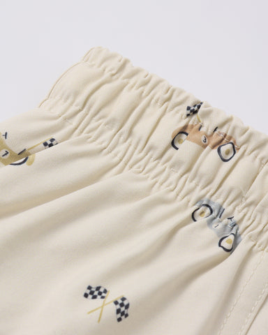 Natural colored swim trunk with race car pattern on a white background