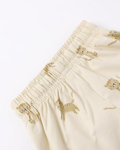 Natural colored shorts with lion pattern on a white background