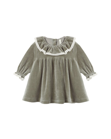 A toddler girl's long-sleeve dress in sage green velvet, featuring a large white ruffled collar with lace trim and matching lace trim on the elasticized cuffs.
