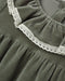 Close-up of a dark olive green dress or nightgown with a gathered neckline and white crochet lace trim.