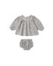A two-piece set with a full gathered blouse, delicate ruffle details, and soft balloon sleeves, finished with a button-back closure for easy dressing. Paired with matching bloomers.