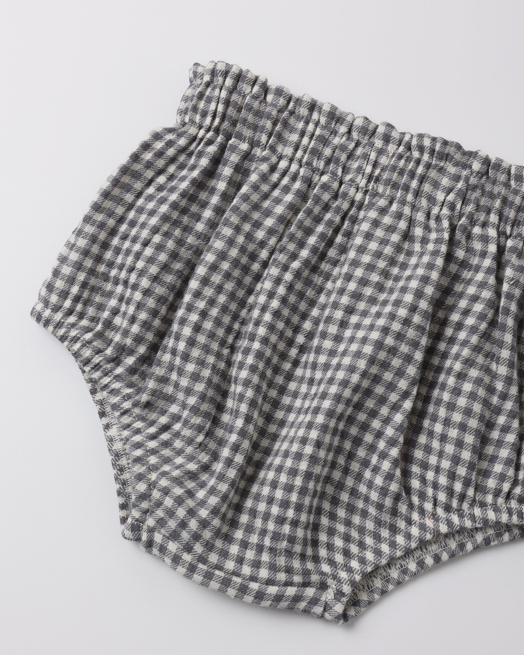A pair of bloomers in a black gingham fabric.