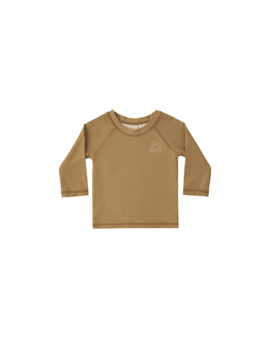 Brown rashguard with a logo on a white background