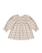 A toddler girl's long-sleeve dress featuring a beige and white gingham plaid pattern, a smocked round neckline, and ruffled cuffs, shown flat on a white background.