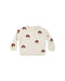 An off-white knit baby sweater featuring an all-over pattern of small brown and white embroidered mushrooms, displayed flat against a solid white background.