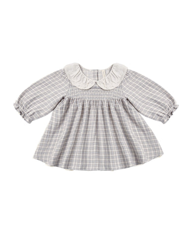 Baby dress with checkered pattern and white collar on a white background