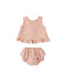 Pink baby outfit with top and bloomers on a white background