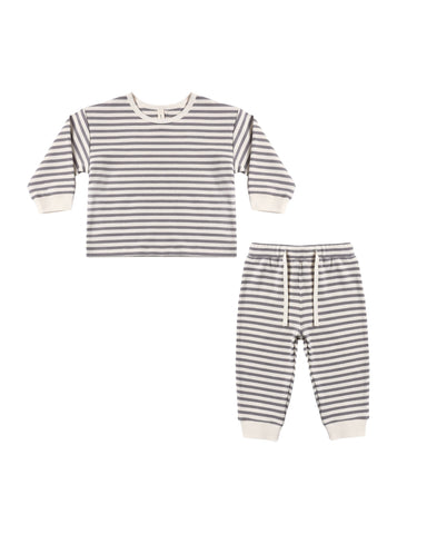 Striped children's outfit with shirt and pants on a white background