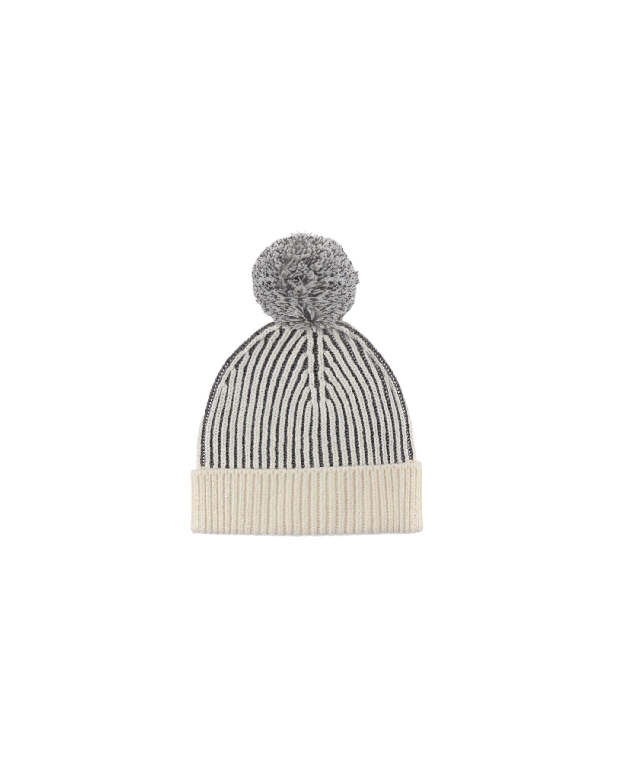 A black and cream beanie on a white background