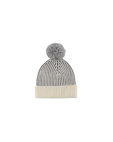 A black and cream beanie on a white background