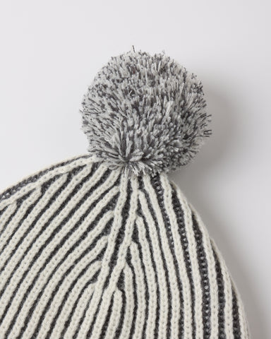 A close up of a black and cream knit fabric