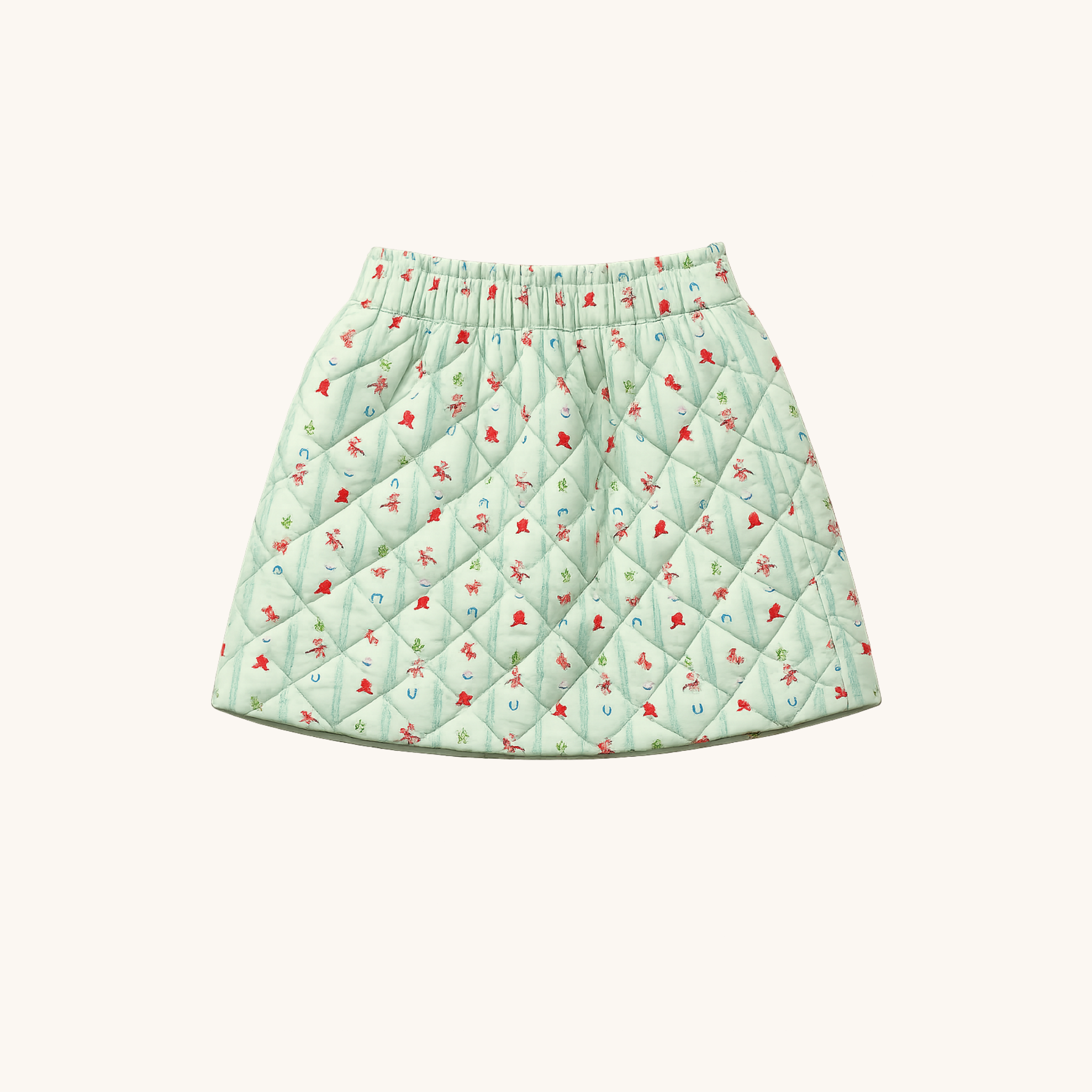 A light mint green quilted skirt with a small rodeo pattern, featuring an elastic waistband, shown against a plain off-white background.