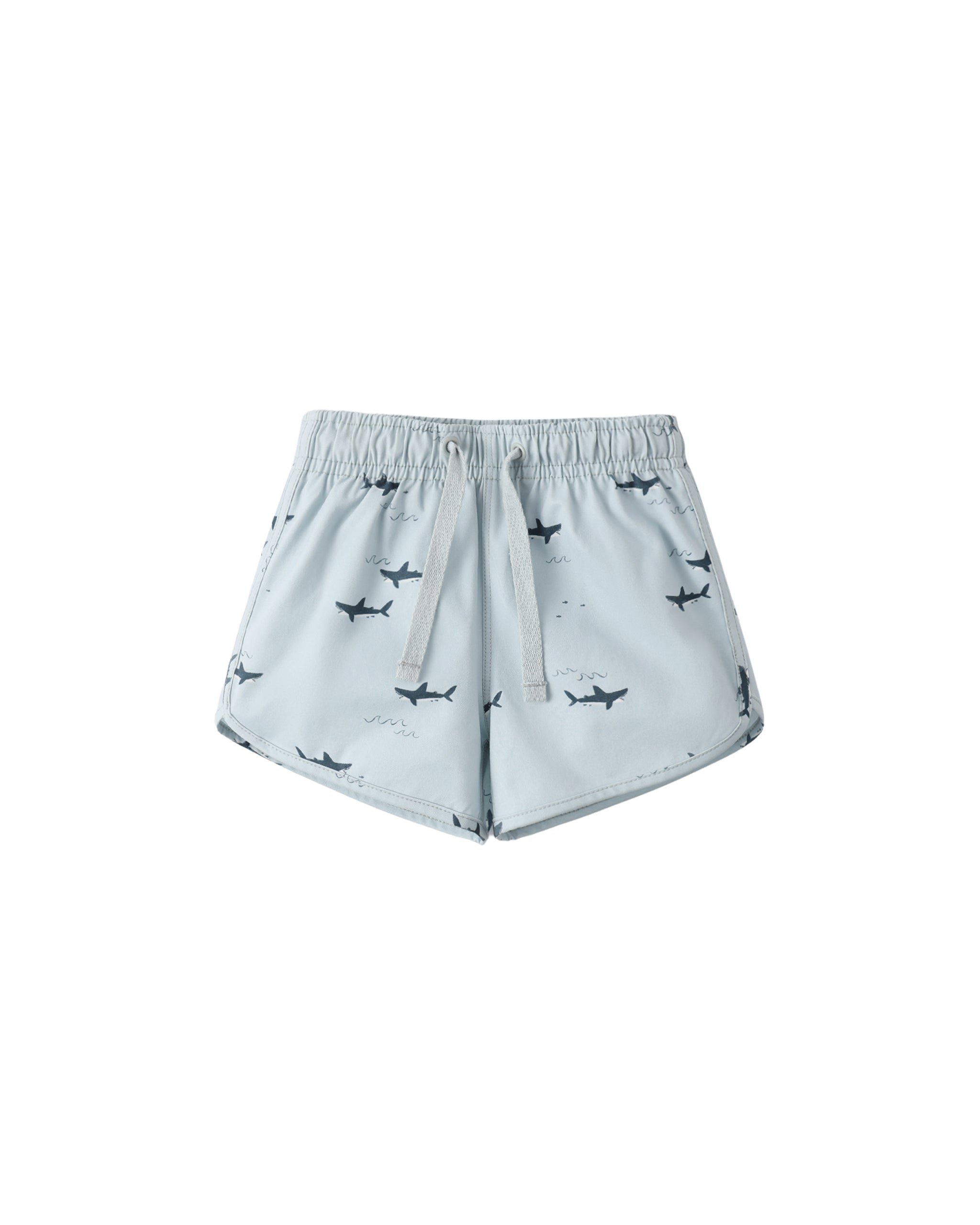 Light blue swim trunk with shark pattern on a white background