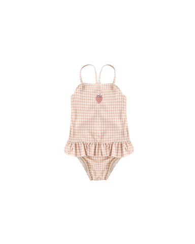 Pink gingham checkered swimsuit with ruffle details on a white background