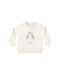 An off-white knit crewneck sweater featuring a central penguin motif with gray wings and small brown feet, displayed flat against a solid white background.