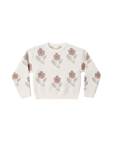 An off-white knit crewneck sweater featuring an all-over pattern of muted pink flowers and sage green leaves, laid flat against a white background.