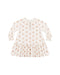 A long sleeve swing dress featuring a gathered lower tier, cinched wrists, and coconut button snaps down the front shown on a white background