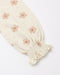 A close-up of a cream-colored fabric sleeve with a smocked elastic cuff and a repeating dusty pink floral pattern, set against a plain white background.