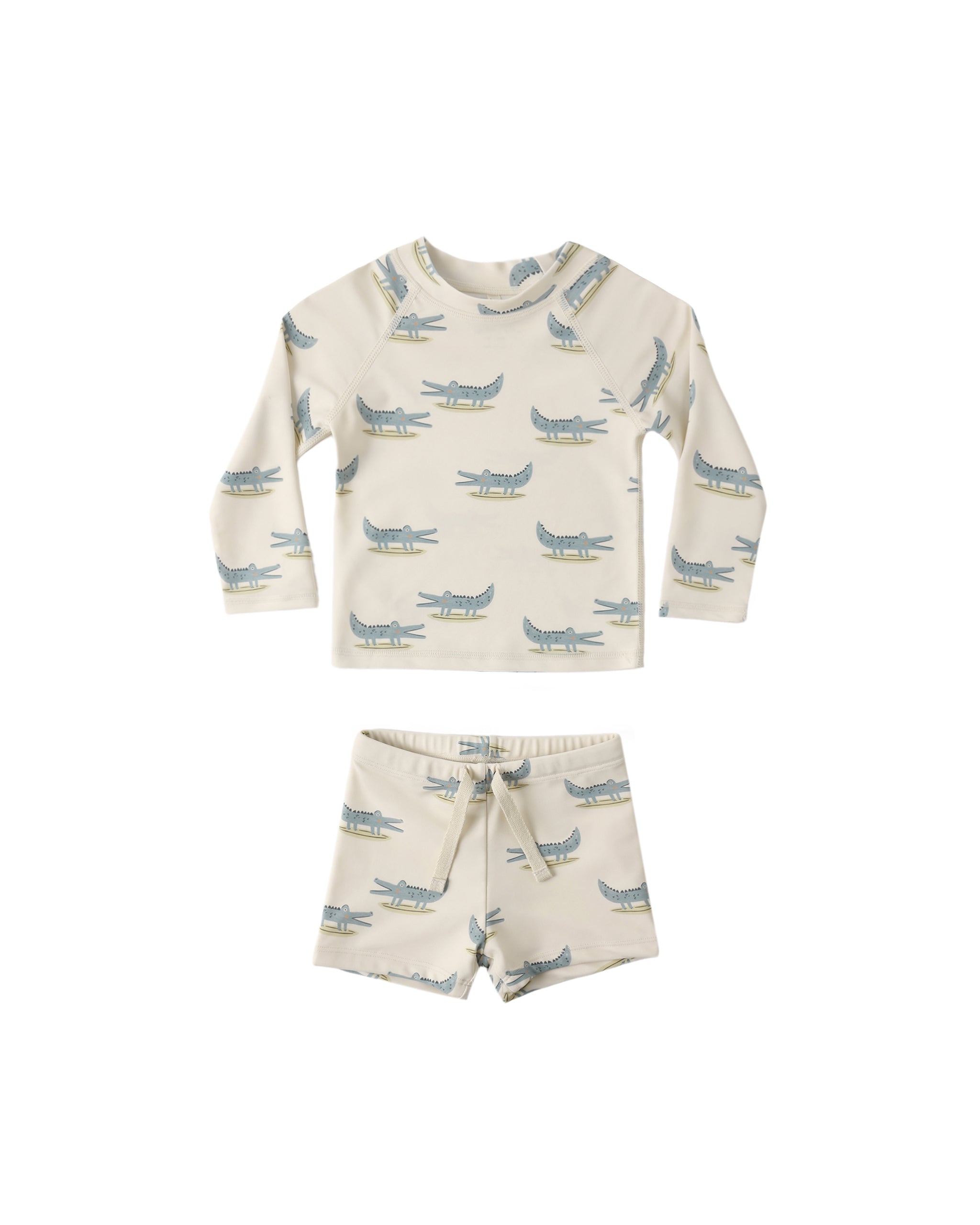 Boy' rashguard set with alligator pattern on a white background 