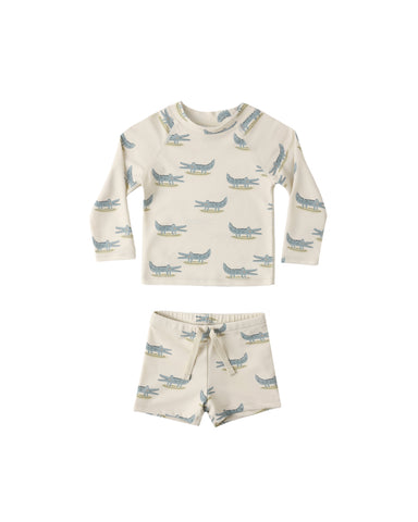 Boy' rashguard set with alligator pattern on a white background 